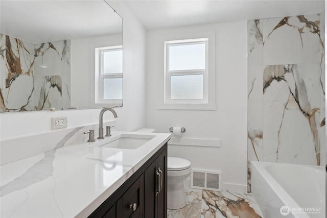2117 S Ash St, Tacoma, WA 98405 - bathroom with vanity, marble finish flooring, a bathtub, and healthy amount of natural light