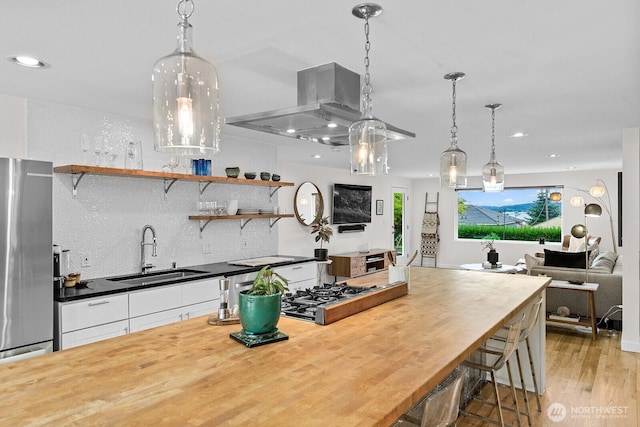 11017 Forest Ave S, Seattle, WA 98178 - kitchen with freestanding refrigerator, decorative backsplash, recessed lighting, open floor plan, and white cabinets