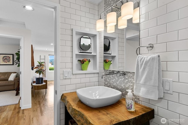 11017 Forest Ave S, Seattle, WA 98178 - ensuite bathroom with wood finished floors, decorative backsplash, and recessed lighting