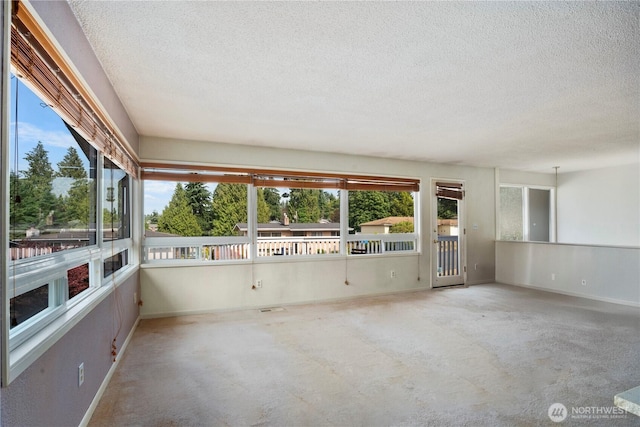 29929 4th Ave SW, Federal Way, WA 98023 - unfurnished sunroom featuring a textured ceiling, plenty of natural light, and carpet
