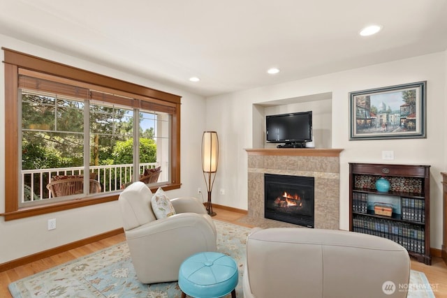 4415 40th Ave SW, Seattle, WA 98116 - living area with wood finished floors, a high end fireplace, and recessed lighting