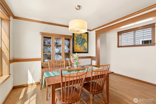 4415 40th Ave SW, Seattle, WA 98116 - dining space with wood finished floors and ornamental molding