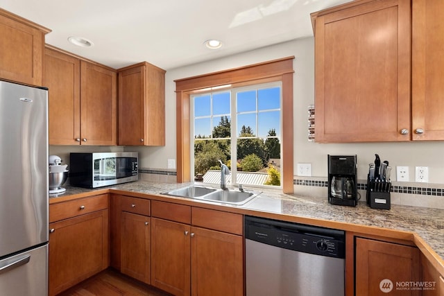 4415 40th Ave SW, Seattle, WA 98116 - kitchen with appliances with stainless steel finishes, tile countertops, brown cabinets, and recessed lighting