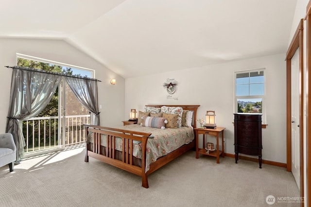 4415 40th Ave SW, Seattle, WA 98116 - carpeted bedroom with multiple windows, vaulted ceiling, and access to exterior
