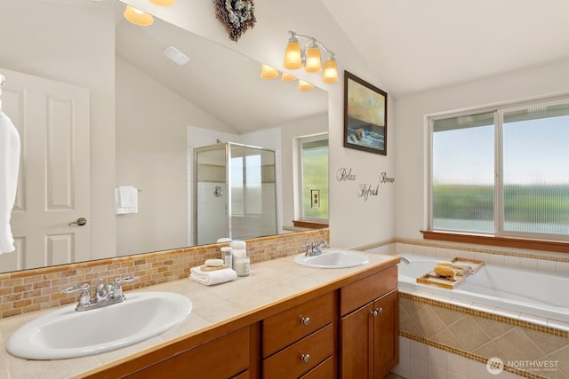 4415 40th Ave SW, Seattle, WA 98116 - bathroom with lofted ceiling, a stall shower, double vanity, a bath, and decorative backsplash