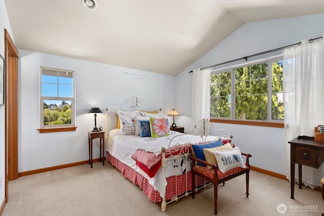4415 40th Ave SW, Seattle, WA 98116 - carpeted bedroom featuring multiple windows and lofted ceiling