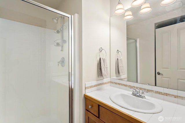 4415 40th Ave SW, Seattle, WA 98116 - bathroom featuring a stall shower, decorative backsplash, and vanity