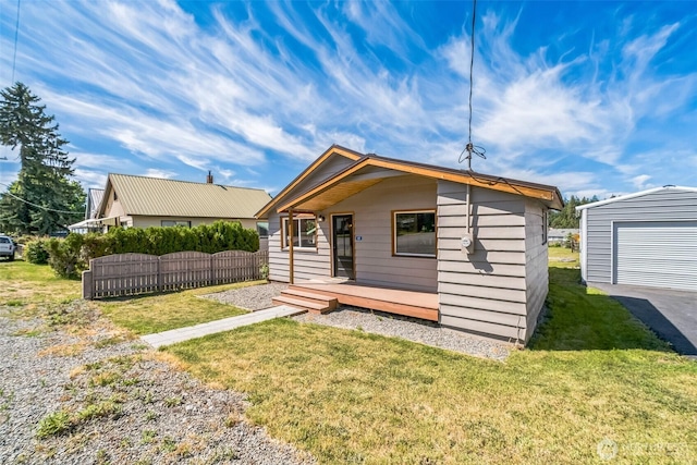 420 3rd St, Ronald, WA 98940 - back of house with an outdoor structure and a garage