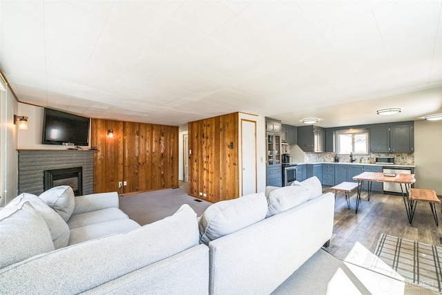 420 3rd St, Ronald, WA 98940 - living room with a fireplace, wooden walls, and wood finished floors