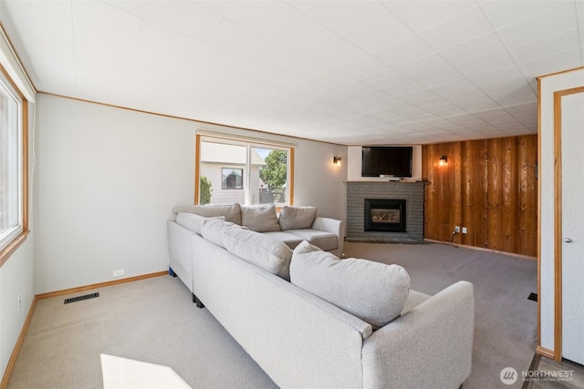420 3rd St, Ronald, WA 98940 - living room featuring a brick fireplace, carpet floors, and wood walls