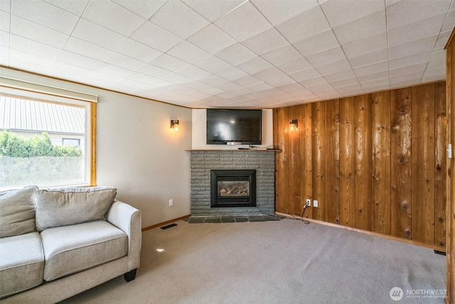 420 3rd St, Ronald, WA 98940 - living room featuring a fireplace, carpet floors, and wooden walls