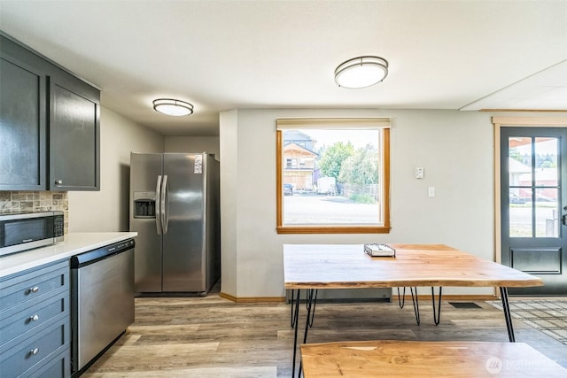 420 3rd St, Ronald, WA 98940 - kitchen featuring appliances with stainless steel finishes, light wood-style flooring, and light countertops