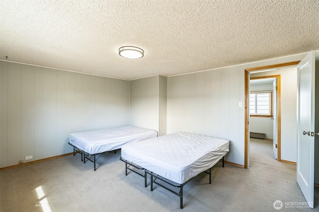 420 3rd St, Ronald, WA 98940 - bedroom featuring light carpet, baseboard heating, and a textured ceiling