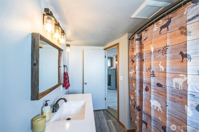 420 3rd St, Ronald, WA 98940 - bathroom with wood finished floors, vanity, and a shower with shower curtain