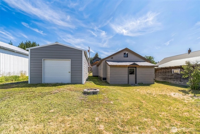420 3rd St, Ronald, WA 98940 - view of green lawn featuring a fire pit, an outbuilding, and a detached garage