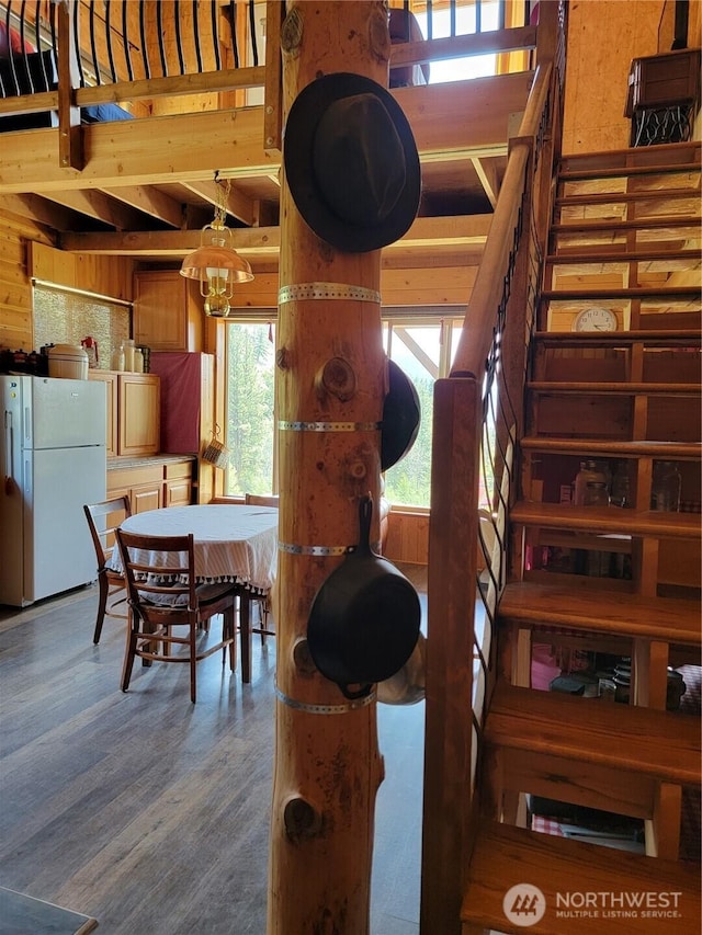 466 Sqove Rd, Wauconda, WA 98859 - dining space with wood finished floors, a chandelier, and stairway