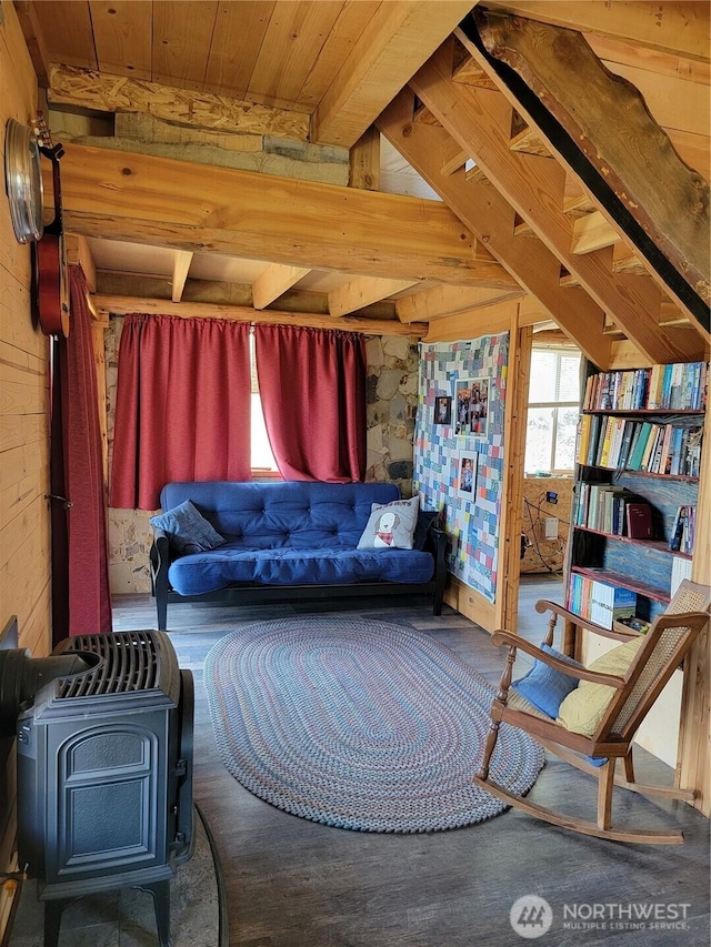 466 Sqove Rd, Wauconda, WA 98859 - living area with a wood stove, wood walls, a wooden ceiling with exposed beams, and wood finished floors