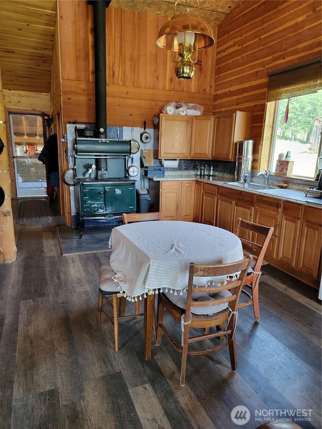 466 Sqove Rd, Wauconda, WA 98859 - kitchen with lofted ceiling, dark wood-type flooring, light countertops, and wood walls