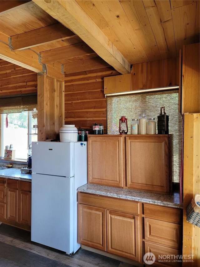 466 Sqove Rd, Wauconda, WA 98859 - kitchen featuring freestanding refrigerator, a wooden ceiling with exposed beams, and dark wood-style floors