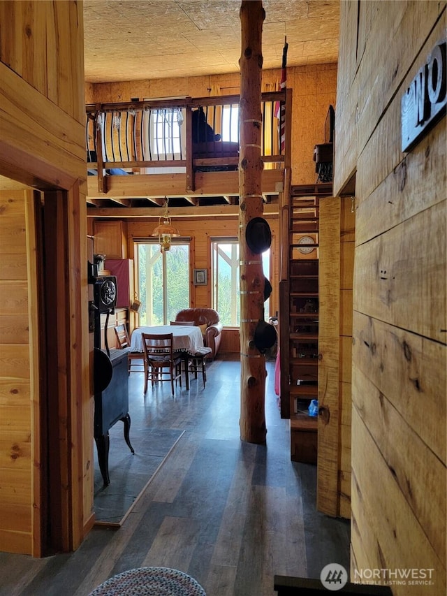 466 Sqove Rd, Wauconda, WA 98859 - living area featuring wooden walls, healthy amount of natural light, wood finished floors, and a towering ceiling