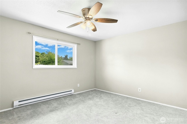 889 SW Kingma Ct, Oak Harbor, WA 98277 - empty room with a baseboard heating unit, carpet floors, and ceiling fan