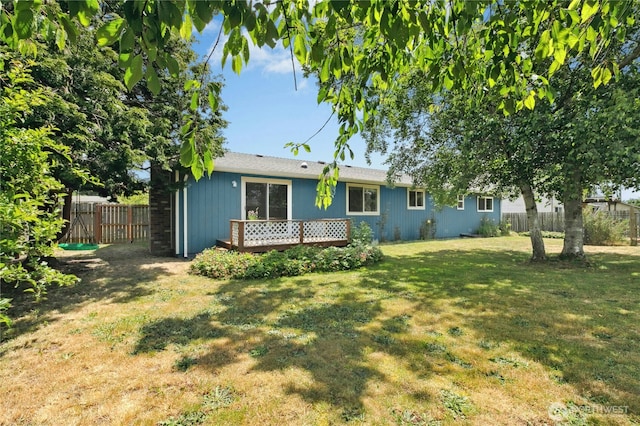 889 SW Kingma Ct, Oak Harbor, WA 98277 - back of house with a fenced backyard and a wooden deck