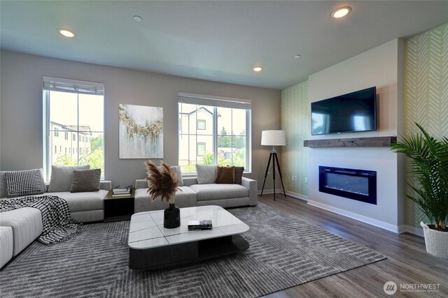 2014 101st Ave SE Unit 6, Lake Stevens, WA 98258 - living room featuring wood finished floors, healthy amount of natural light, recessed lighting, a glass covered fireplace, and wallpapered walls