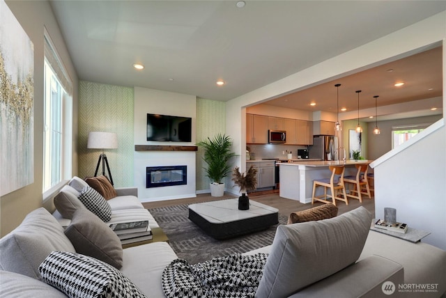 2014 101st Ave SE Unit 6, Lake Stevens, WA 98258 - living room with recessed lighting, a glass covered fireplace, and wallpapered walls