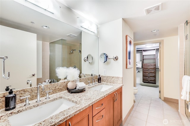 10650 NE 9th Pl Unit 3208, Bellevue, WA 98004 - full bathroom with a stall shower, double vanity, a spacious closet, and tile patterned floors