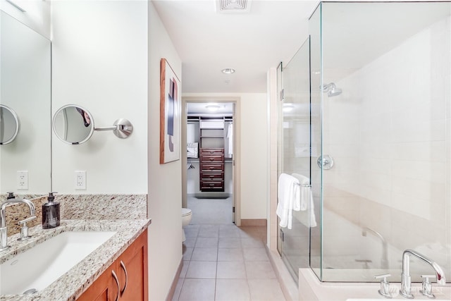 10650 NE 9th Pl Unit 3208, Bellevue, WA 98004 - bathroom with a stall shower, vanity, and tile patterned floors