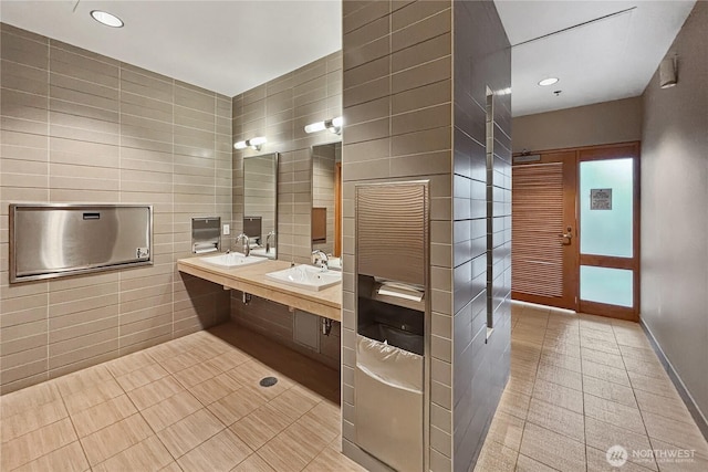 10650 NE 9th Pl Unit 3208, Bellevue, WA 98004 - bathroom featuring tile patterned flooring, tile walls, double vanity, and recessed lighting
