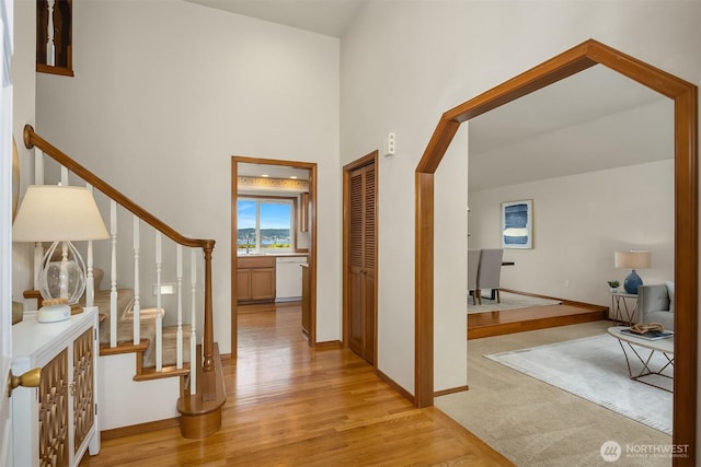 1021 N Sunset Dr, Camano Island, WA 98282 - foyer entrance with light wood-style flooring, stairs, and a high ceiling