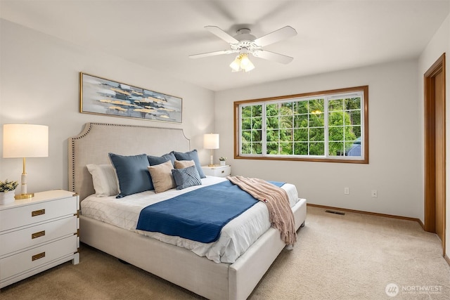 1021 N Sunset Dr, Camano Island, WA 98282 - bedroom featuring light colored carpet and ceiling fan