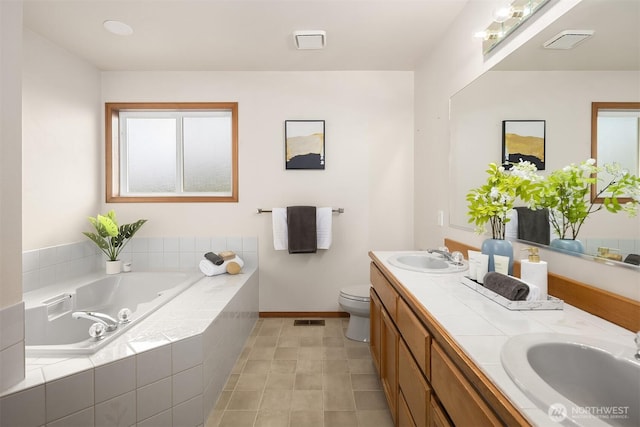 1021 N Sunset Dr, Camano Island, WA 98282 - bathroom with double vanity, a bath, and tile patterned floors