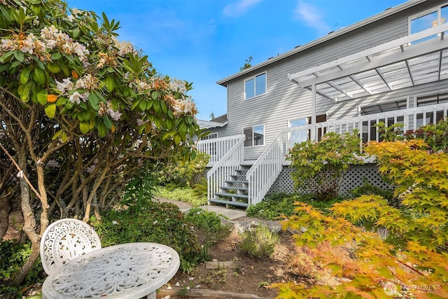 1021 N Sunset Dr, Camano Island, WA 98282 - rear view of house featuring a wooden deck, a pergola, and stairway