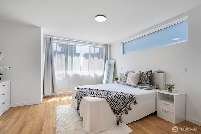 2620 NW 62nd St Unit B, Seattle, WA 98107 - bedroom featuring light wood-style floors and baseboards