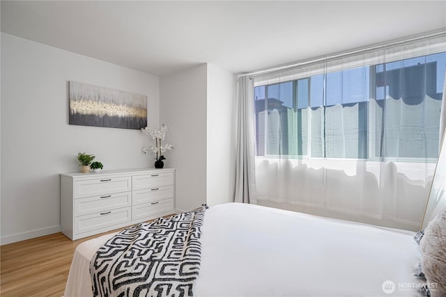 2620 NW 62nd St Unit B, Seattle, WA 98107 - bedroom featuring light wood-type flooring and baseboards