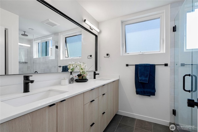 2620 NW 62nd St Unit B, Seattle, WA 98107 - bathroom featuring a stall shower, double vanity, and tile patterned floors