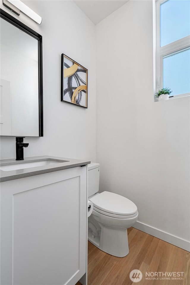 2620 NW 62nd St Unit B, Seattle, WA 98107 - bathroom with wood finished floors and vanity