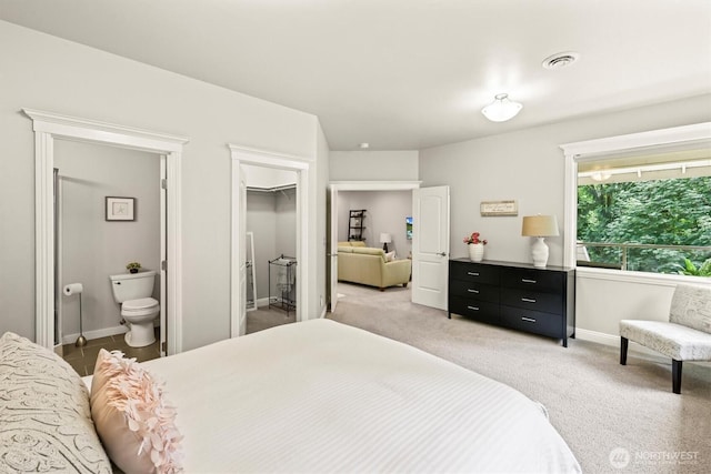 3303 Gravelly Beach Loop NW, Olympia, WA 98502 - bedroom featuring light colored carpet, ensuite bath, and a walk in closet