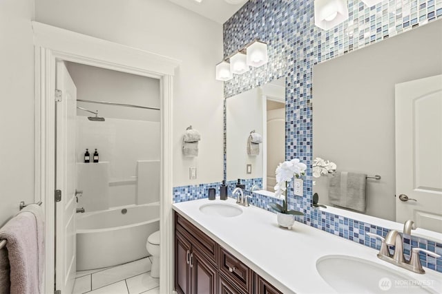 3303 Gravelly Beach Loop NW, Olympia, WA 98502 - full bathroom featuring double vanity, shower / tub combination, tile patterned flooring, tile walls, and tasteful backsplash