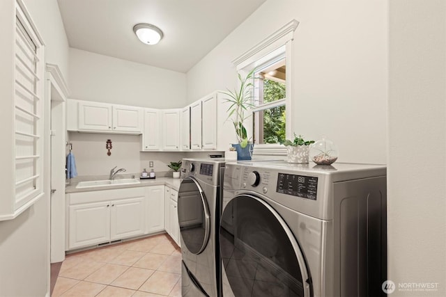 3303 Gravelly Beach Loop NW, Olympia, WA 98502 - laundry room featuring washer and dryer, light tile patterned flooring, and cabinet space