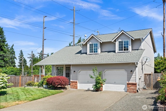 4509 224th Street Ct E, Spanaway, WA 98387 - view of front facade with brick siding, a shingled roof, asphalt driveway, and an attached garage
