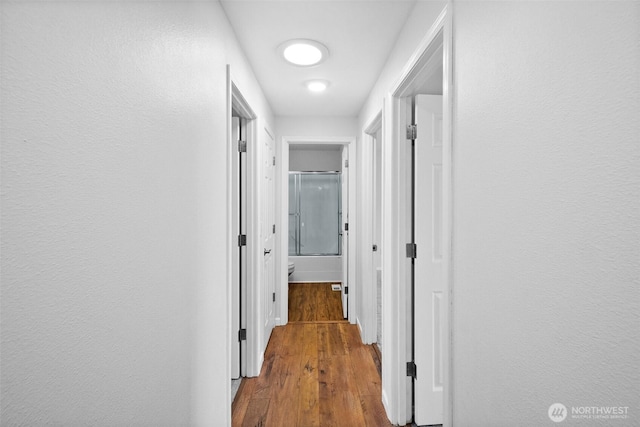 4509 224th Street Ct E, Spanaway, WA 98387 - corridor featuring wood finished floors and baseboards