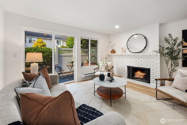 957 12th St NE Unit 1009, Auburn, WA 98002 - living area featuring light wood-style floors, a fireplace, and recessed lighting