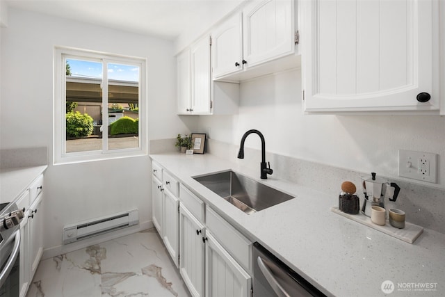 957 12th St NE Unit 1009, Auburn, WA 98002 - kitchen featuring a baseboard radiator, white cabinets, light marble finish flooring, stainless steel range oven, and light stone counters
