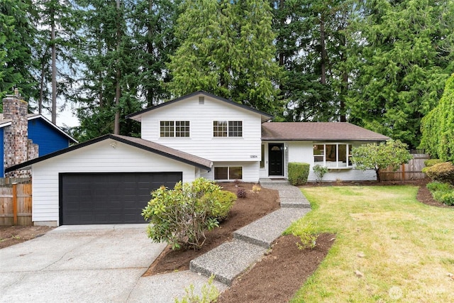 12804 NE 139th Ct, Kirkland, WA 98034 - split level home with concrete driveway and a garage
