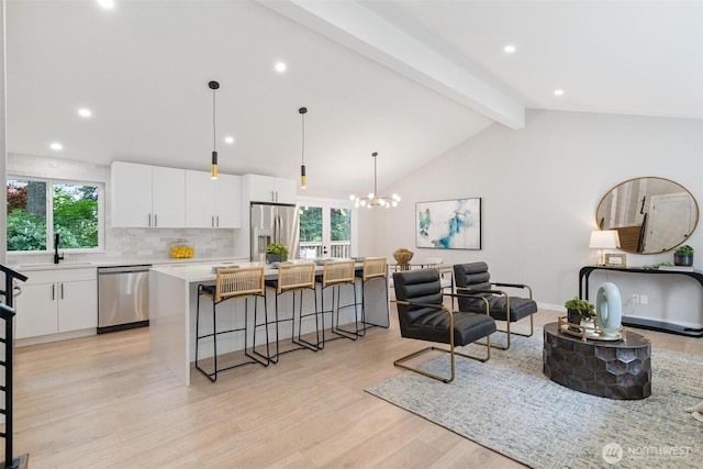 12804 NE 139th Ct, Kirkland, WA 98034 - living room featuring healthy amount of natural light, light wood-style flooring, a chandelier, and recessed lighting