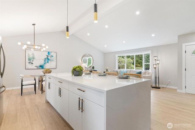 12804 NE 139th Ct, Kirkland, WA 98034 - kitchen featuring light wood-style floors, pendant lighting, white cabinetry, a kitchen island, and recessed lighting