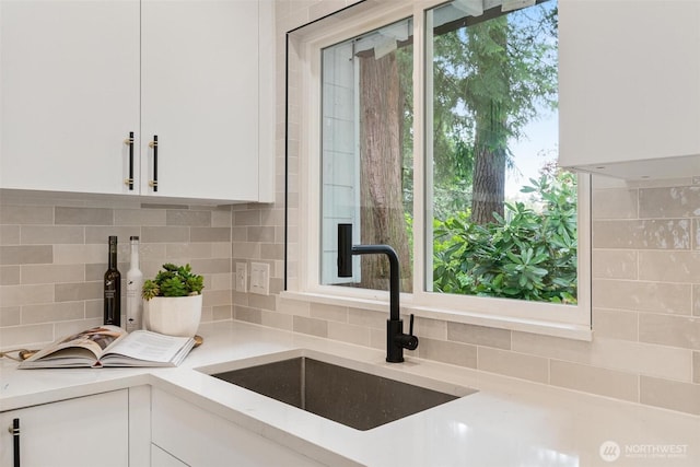 12804 NE 139th Ct, Kirkland, WA 98034 - kitchen with white cabinets, light countertops, and decorative backsplash